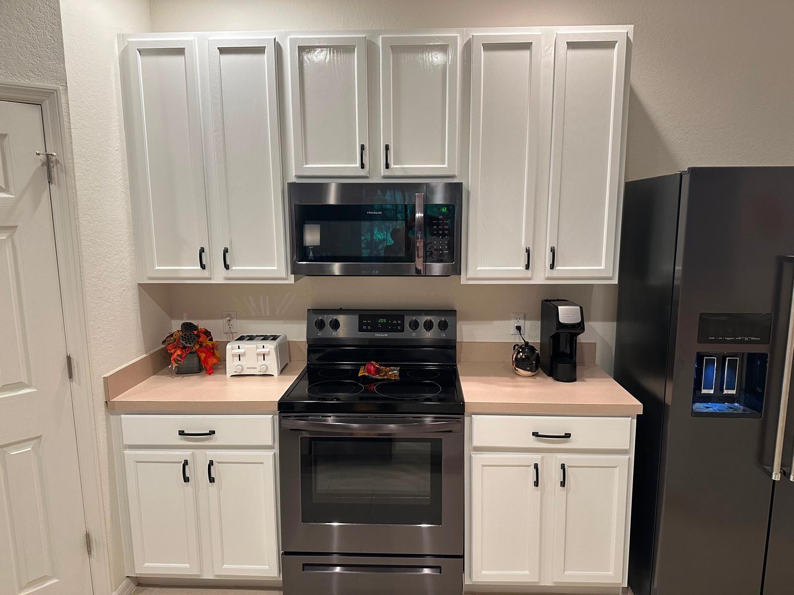 Kitchen cabinets after painting by Rise and Shine